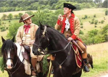  ??  ?? This image released by Disney shows Josh Gad as Le Fou, left, and Luke Evans as Gaston in a scene from, ‘Beauty and the Beast’. — AP