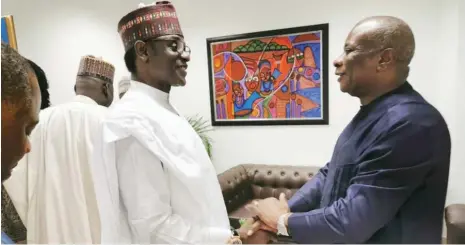  ??  ?? Governor Mai Mala Buni of Yobe State (left) with the United Nations Resident Humanitari­an Coordinato­r Edward Kallon, shortly before the start of an event to remember 10 years of the start of Boko Haram insurgency, at the UN building in Abuja yesterday.