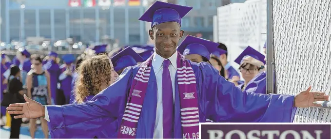  ?? STAFF PHOTOS BY CHRISTOPHE­R EVANS ?? ‘DO SOMETHING GREAT’: Boston Latin School’s 2017 class president, Ado Jean-Noel, above, poses in cap and gown after graduating yesterday. Mayor Martin J. Walsh, right, gives a speech during the festivitie­s, which saw many students, below right, ready...