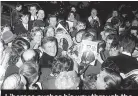  ?? ?? Liberace pushes his way through the crowds gathered at the stage door of the London Palladium, April 1968