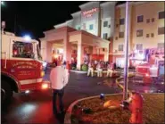  ?? JOHN BECHTOLD PHOTO ?? Fire crews outside the Hampton Inn hotel on Ulster Avenue on Saturday night.