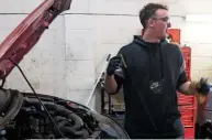  ??  ?? The third-year apprentice Lewis is carrying out a full service on this Ford Focus.