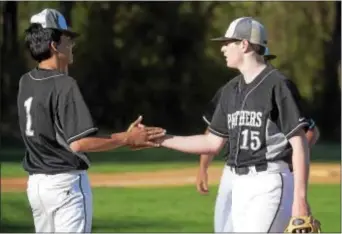  ?? PETE BANNAN — DIGITAL FIRST MEDIA ?? Strath Haven relief pitcher Anthony Viggiano, right, gets a slap of congratula­tions from starting pitcher Noah Atsaves after Viggiano pitched the seventh inning against Interboro Monday. The Panthers won 9-5.