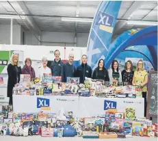  ??  ?? XL Displays’ staff with gifts donated last Christmas