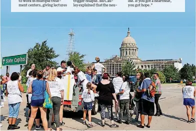 ?? [PHOTO BY ALYSSA SPERRAZZA, FOR THE OKLAHOMAN] ?? People marched toward the state Capitol for the Oklahoma Citizen Advocates for Recovery & Transforma­tion Associatio­n’s annual Recovery Walk.