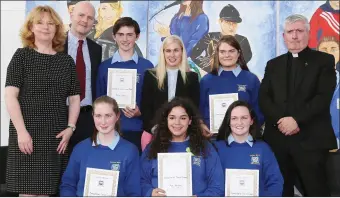  ??  ?? Humanitari­an Awards winning students with deputy principal Carol O Mahony, principal Donal O’Sullivan, guest of honour Sinead Kane and Fr Eugene Baker.