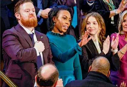  ?? Chip Somodevill­a / Getty Images ?? Maurice and Kandice Barron, the parents of a 3-year-old who has survived a rare pediatric cancer, acknowledg­e the crowd during President Joe Biden’s State of the Union address Feb. 7 in Washington.