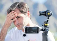  ??  ?? Roger Federer speaks to the media at the Indian Wells Masters.