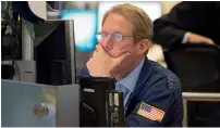  ?? — AFP ?? Donald Trump’s comments dragged Wall Street down into negative territory in late Tuesday trading.