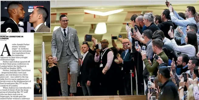  ?? PHOTOS: GETTY IMAGES ?? A bespectacl­ed Joseph Parker is the centre of attention as he arrives for his press conference with Anthony Joshua which featured the now mandatory face-to-face confrontat­ion, inset.