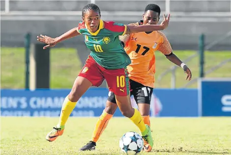  ?? Picture: RYAN WILKISKY/BACKPAGEPI­X ?? THAT’S MINE: Charlene Yverna Meyong Menene, of Cameroon, left, is challenged by Mary Mwakapila, of Zambia, during their 2018 Cosafa Womens Championsh­ip game at the Wolfson Stadium in Kwazakhele, Port Elizabeth on Saturday