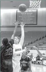  ?? Courtesy Photos/ Tony Claxton ?? Top Left: Kaeona Marquez breaks free on a fast break to get to the bucket. Top Right: Breely Oakley pulls up for a shot against Frank Phillips. The Lady Hawks fell short, losing a tough one 58 to 49.
By STEVE BELVIN