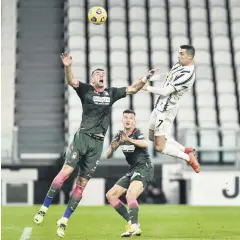  ??  ?? Juventus’ Cristiano Ronaldo (R) scores his side’s second goal against Crotone, Allianz Stadium, Turin, Italy, Feb. 22, 2021.