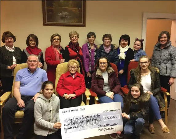  ??  ?? Eileen McGrath with family and friends making a presentati­on of €2,500 to Sligo Cancer Services following her 80th birthday party in the Coach House Hotel, Ballymote.