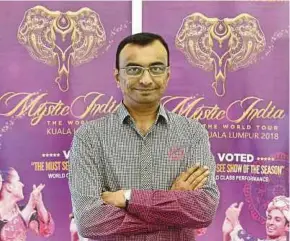  ?? PIC BY MOHD KHAIRUL HELMY MOHD DIN ?? Eeman Corporatio­n Sdn Bhd promotions and events head Gavin Singh standing in front of Mystic India: The World Tour posters. The show will open from April 5 to 11 at Istana Budaya.