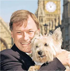  ?? ?? Amess in 2000, when he was promoting an animal welfare bill: he developed a strong personal following, and as one journalist put it, ‘he never completed a sentence without mentioning his constituen­cy’