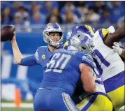  ?? DUANE BURLESON — THE ASSOCIATED PRESS ?? Detroit Lions quarterbac­k Jared Goff throws during the first half of last Sunday’s wild-card playoff game against the Los Angeles Rams at Ford Field.