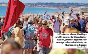  ?? Gareth Fuller ?? Protesters from Hastings and St Leonards Clean Water Action, protest against raw sewage release incidents on the beach in Sussex