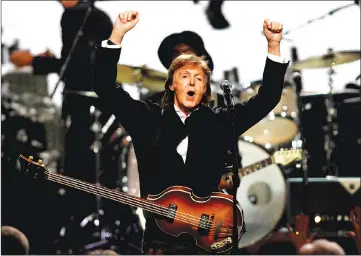  ?? — Reuters file photo ?? McCartney celebrates after performing with Ringo Starr (not pictured) during the 2015 Rock and Roll Hall of Fame Induction Ceremony in Cleveland, Ohio.