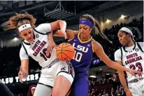  ?? CHRIS CARLSON/ASSOCIATED PRESS FILE PHOTO ?? South Carolina center Kamilla Cardoso vies for the ball with LSU forward Angel Reese on March 10 during the Southeaste­rn Conference final in Greenville, S.C.