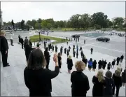  ?? ALEX BRANDON — THE ASSOCIATED PRESS ?? Female members of Congress stand on the steps of the U.S. Capitol and wave as the hearse carrying the flagdraped casket of Justice Ruth Bader Ginsburg departs after Ginsburg lied in state at the U.S. Capitol, Friday, in Washington.