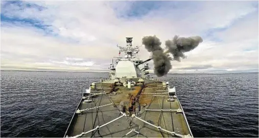  ??  ?? BLAST FROM THE PAST: Royal Navy frigate HMS Iron Duke during high-explosive training in San CarlosWate­r and Falkland Sound