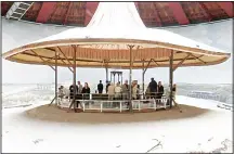  ??  ?? Visitors stand in the ‘rotunda’, installed by Dutch painter Hendrik Willem
Mesdag, to look at his work ‘Panorama Mesdag’. (AFP)