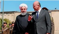  ?? AP ?? iranian President rouhani with his iraqi counterpar­t barham Salih at Salam Palace in baghdad on Monday. —