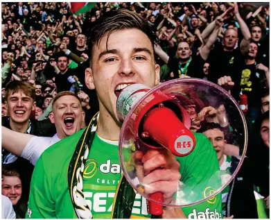  ??  ?? Loud and clear: Tierney chants with the Celtic fans after clinching seven titles in a row