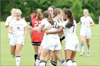  ?? Bud Sullins/Special to Siloam Sunday ?? Siloam Springs’ girls celebrate after scoring a goal in the Lady Panthers’ 6-1 victory over Russellvil­le in the Class 6A state championsh­ip game. The win was Siloam Springs’ fourth straight state championsh­ip.