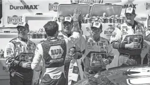  ?? MATTHEW OHAREN/USA TODAY SPORTS ?? Chase Elliott high-fives members of his team after winning the DURAMAX Drydene 400 on Monday at Dover Motor Speedway. The victory ended a 26-race winless streak for Elliott.