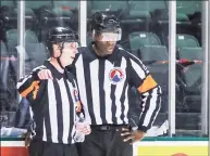  ?? Andy Nietupski / Texas Stars / Contribute­d Photo ?? AHL official Jordan Samuels-Thomas speaks with another official during a hockey game between the Texas Stars and Iowa Wild at the H-E-B Center on Feb. 26, 2021 in Cedar Park, Texas. Samuels is a former Quinnipiac University standout.