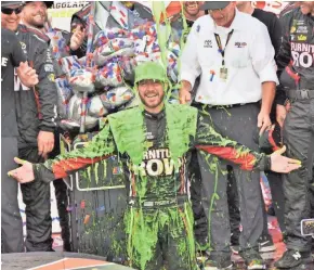  ?? KIM KEMPERMAN / FOR THE JOURNAL SENTINEL ?? Winner Martin Truex Jr. gets slimed in victory lane after the Tales of the Turtles 400 at Chicagolan­d Speedway, the opener of the Monster Energy NASCAR Cup playoffs.