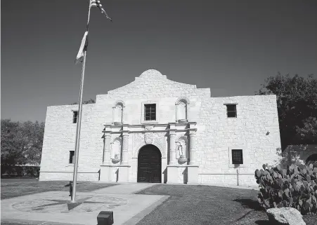  ?? Kin Man Hui / Staff photograph­er ?? Twenty years ago this month, the former Alamo Federal Credit Union opened its home office with a building that’s a near replica of the Alamo. Now BioBridge Global, the parent company of the nearby South Texas Blood & Tissue Center, uses it for offices.