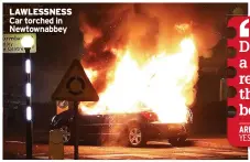  ??  ?? LAWLESSNES­S Car torched in Newtownabb­ey