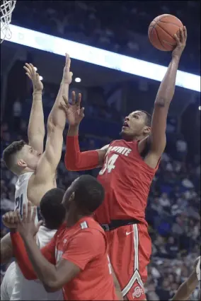  ?? GARY M. BARANEC — THE ASSOCIATED PRESS ?? Ohio State’s Kaleb Wesson puts up a left-handed shot over Penn State’s John Harrar on Jan. 18in State College, Pa.