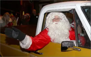  ??  ?? Santa Claus arriving to turn on the Christmas lights in Enniscorth­y last year.