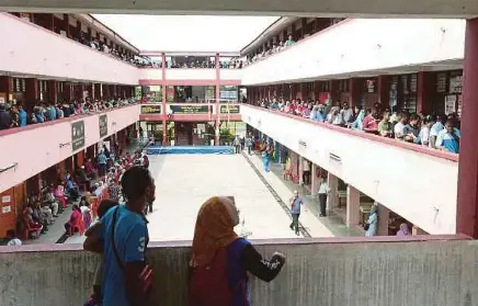  ?? FILE PIC ?? People queuing up to cast their votes during the 14th General Election in May. Old habits may die hard but a new mindset is needed to deal with new realities.