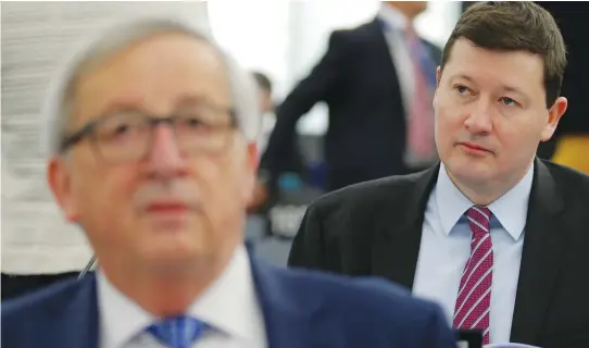  ??  ?? General Secretary of the European Commission Martin Selmayr sits behind European Commission President Jean-Claude Juncker ahead of a debate on the guidelines on the framework of future EU-UK relations at the European Parliament in Strasbourg. (Reuters)