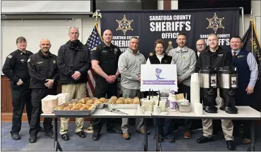  ?? EMMA RALLS — MEDIANEWS GROUP ?? Kimberly Tribley, Owner of Coffee Planet, donated bagels and Coffee to The Saratoga County Sheriff’s Department in honor of Leap of Kindness Day.