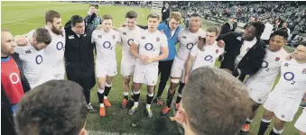  ??  ?? Time to celebrate! England’s Owen Farrell (centre) and his team-mates celebrate after their victory.