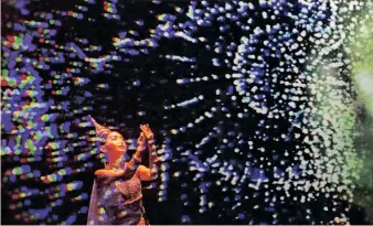  ?? ?? A PERFORMER dances during the exhibition ‘With Love for the Nation’ to celebrate Thai Queen Sirikit’s 90th birthday, in Bangkok, Thailand, on Thursday. The interactiv­e exhibit highlights environmen­tal and conservati­on projects initiated by the queen. Her birthday is on August 12. | EPA-EFE / DIEGO AZUBEL