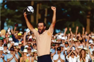  ?? Maddie Meyer/Getty Images ?? Scottie Scheffler allows himself a show of emotion after calmly conquering the Masters field Sunday.