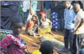  ?? AL-HADJI KUDRA MALIRO / ASSOCIATED PRESS ?? Family members and onlookers mourn over the bodies of civilians killed by Allied Democratic Forces rebels in Beni, Eastern DR Congo, in this photo taken on Friday, Oct 5.