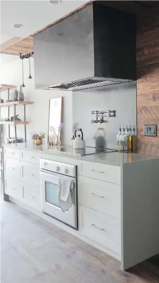  ?? JANIS NICOLAY ?? Above: Where possible, interior designer Ami McKay tries to hide kitchen appliances away and opts for fridge, freezer, dishwasher and microwave drawers to keep things below counter level and create an open, airy space. Range hood fans, on the other...