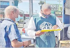  ?? Picture: ADRA ?? ADRA Fiji volunteer Tom Victor leads the distributi­on team in Nakasi.