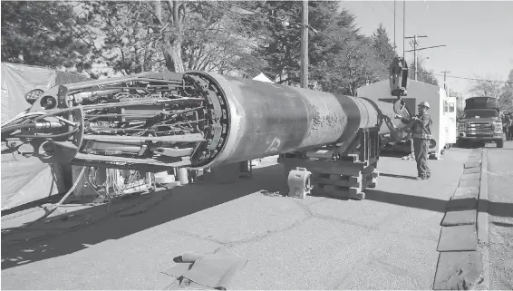  ??  ?? A device known as the “Goose” is being used to weld individual sections of pipeline together from the inside, in the staging area along Niagara Street. The device streamline­s the assembly process, allowing crews to keep neighbourh­ood disruption to a...