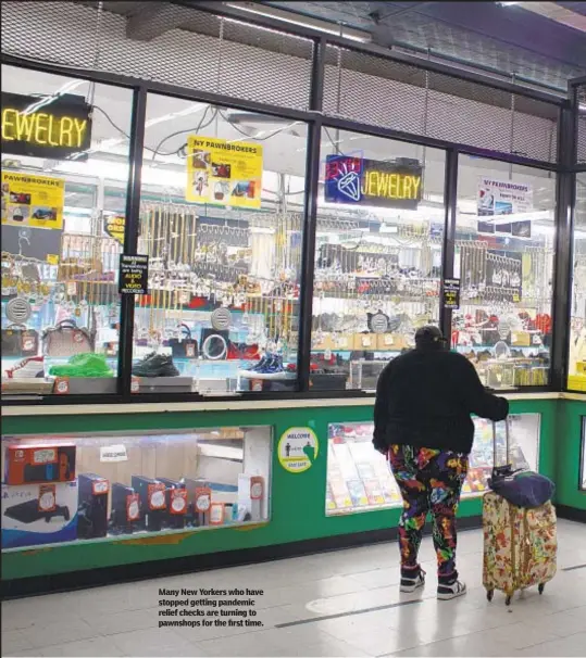  ?? ?? Many New Yorkers who have stopped getting pandemic relief checks are turning to pawnshops for the first time.