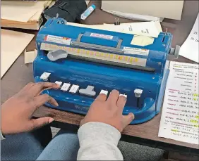  ?? COURTESY OF STATE PUBLIC INFORMATIO­N OFFICER ANDRIUS BANEVICIUS ?? One of the typewriter-like machines used at the Janet S. York Correction­al Institutio­n in East Lyme to transcribe documents into Braille for the visually impaired.