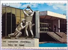  ?? ,PAUL WILSON PHOTO ?? The official postcard of the Canadian Football Hall of Fame. They’ve just stripped the name from the museum, but what happens to that shiny sculpture called Touchdown?